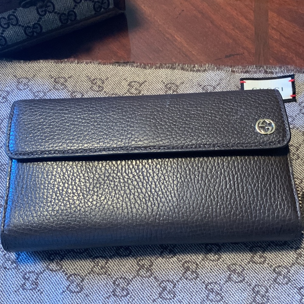 Genuine GUCCI Tri- fold Wallet, chocolate Brown, with two inside section.